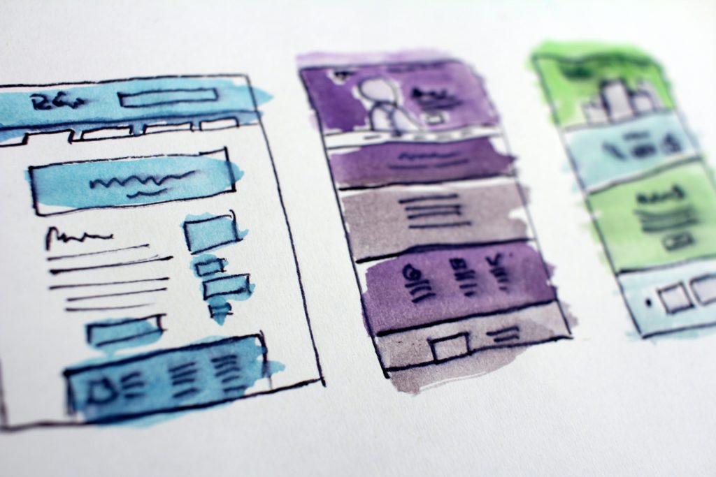 Three separate web design wireframes