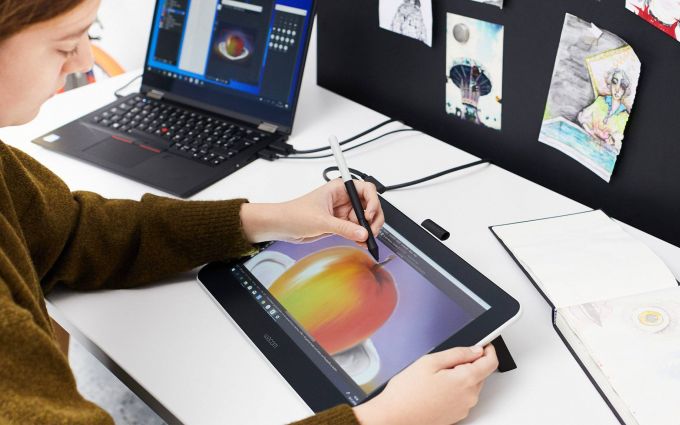 An artist using a Wacom drawing pad