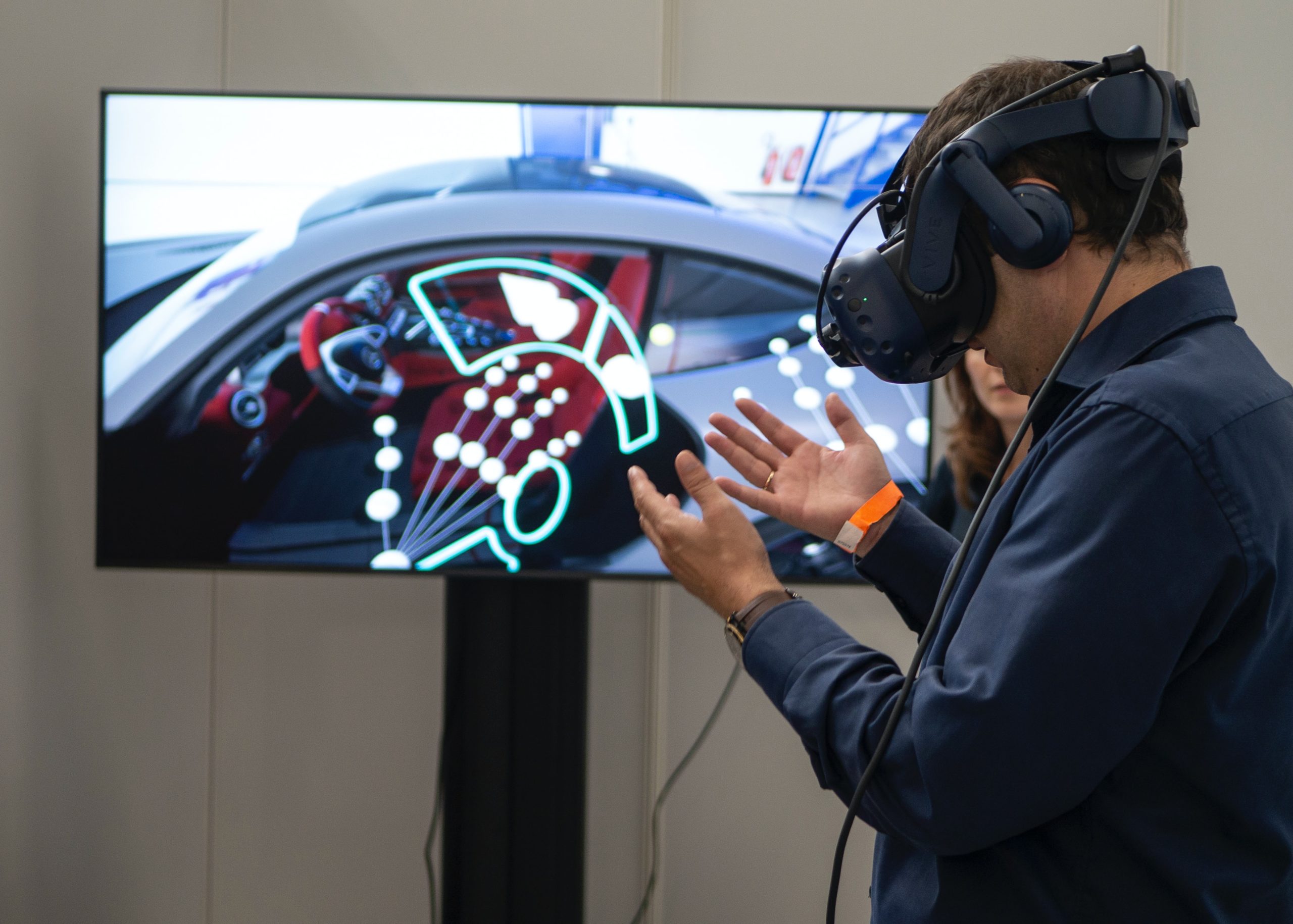 A man using a VR headset at a 2019 exhibition in Stuttgart, Germany