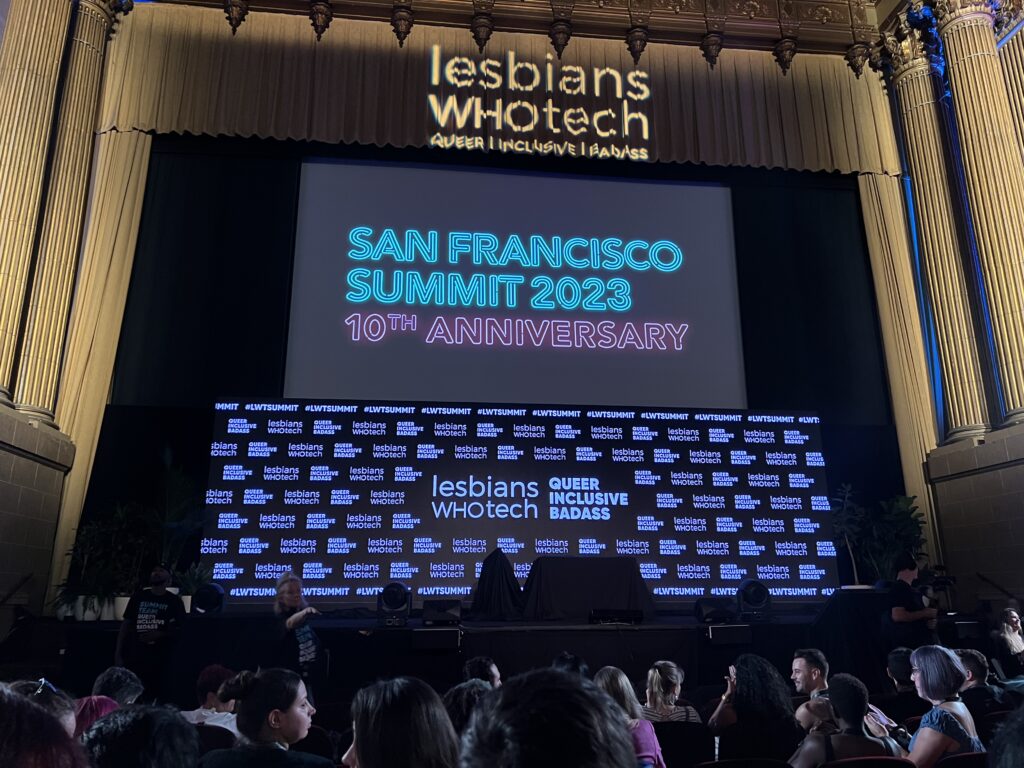 A photo of the Lesbians Who Tech San Francisco Summit 2023 - 10th Anniversary from the 7th or 8th row in the Castro Theater taken with iPhone 13 Pro by Hayley Turner